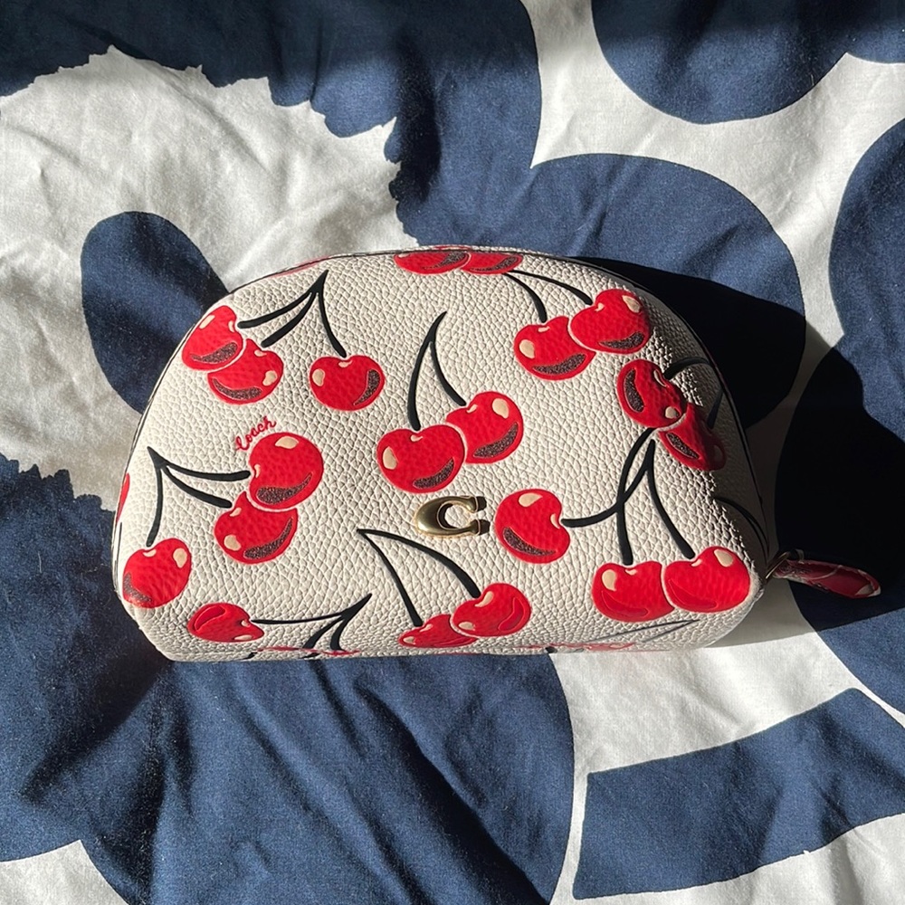 Like new coach medium leather pouch cherry print